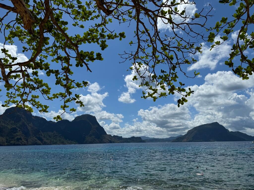 A view of Cadlao Island surrounded by blue waters as seen from Helicopter Island (Dilumacad Island).