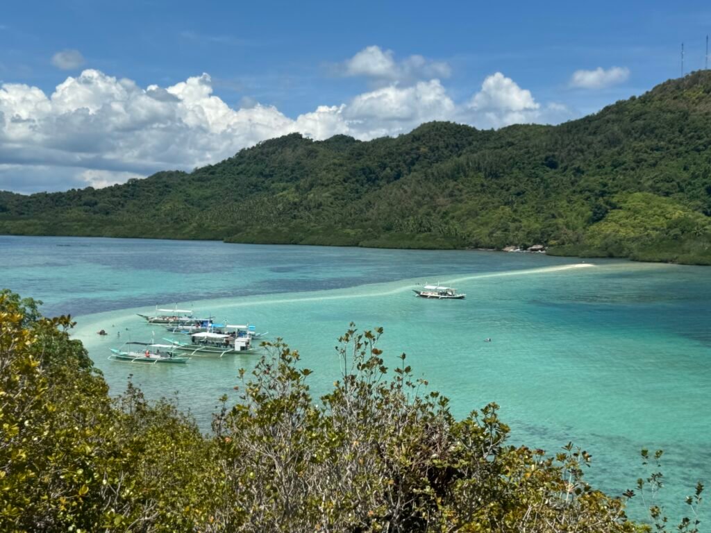 A white sandbar connecting two islands in El Nido, Philippines.