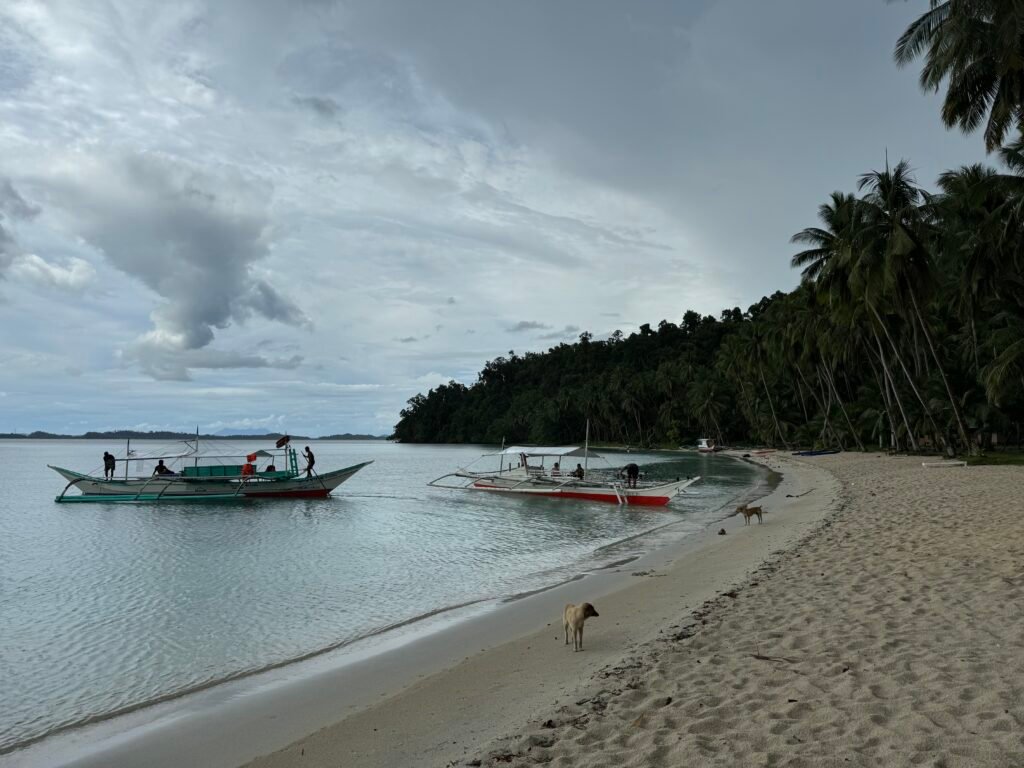 Boats prepare to leave White Beach.